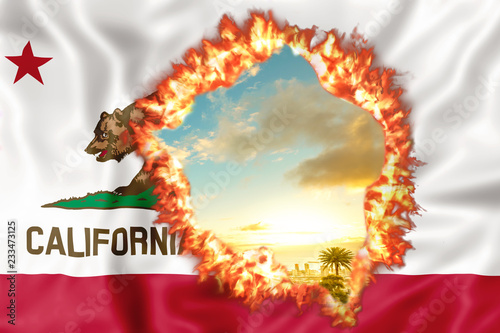 Fires in California in 2018. California Republic Flag on fire with sky sunset background. The fire that is affecting California is considered the most devastating and deadly ever seen in the US state. photo