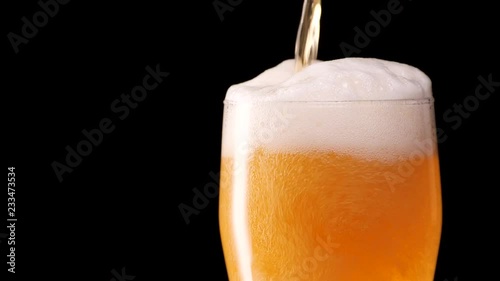 Wallpaper Mural Light beer pouring in glass. With bubbles and foam. Torontodigital.ca