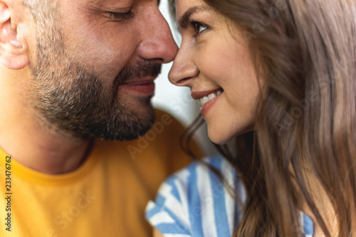 I love you. Close up of sweet couple looking at each other and smiling
