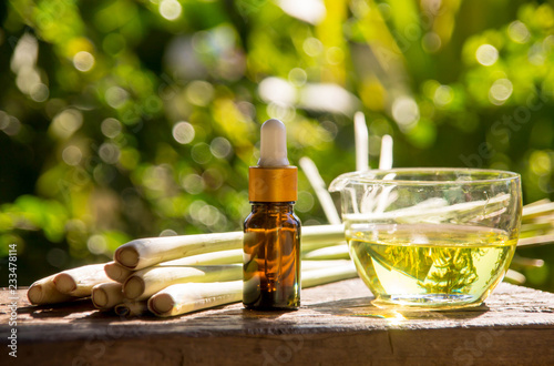 Lemongrass essential oil is placed on the table using a hand-drip oil lemongrass oil - spa and insect repellent.