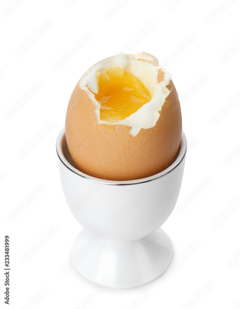 Holder with soft boiled egg on white background