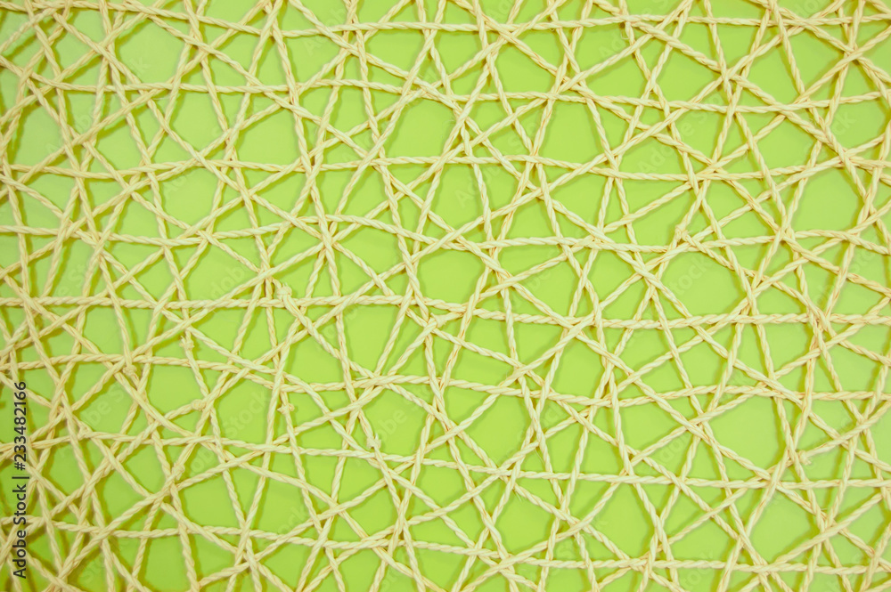 woven mesh of artificial material on green background woven mesh of artificial material on green background