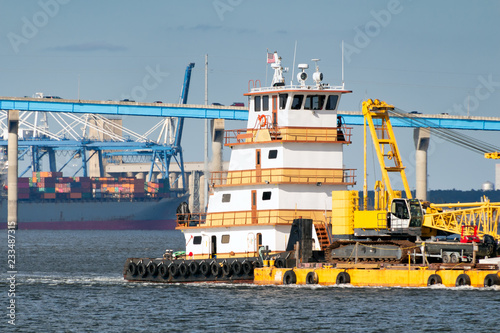 Barge with shipping in background