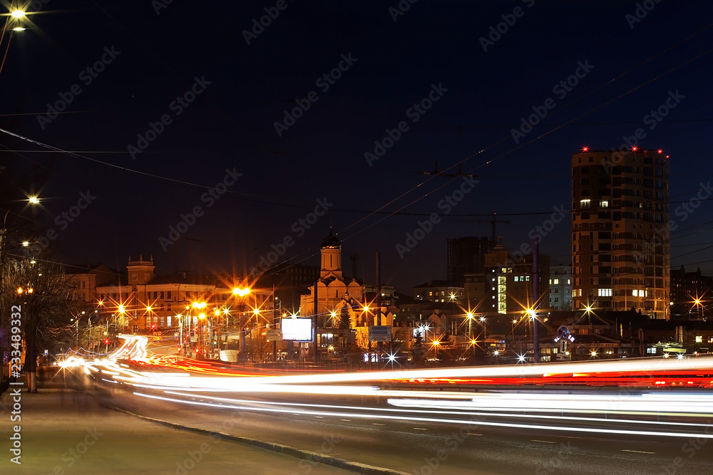 night Avenue with cars at speed