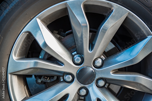 Automotive Alloy Wheels with tire and disk brake pad cover.