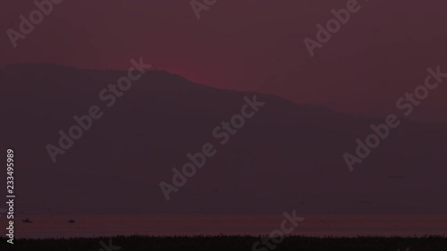 Wildfire Sunset over a lake