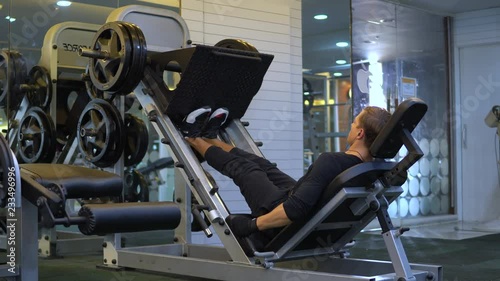 Performing Calf Leg Press  exercise at the gym photo