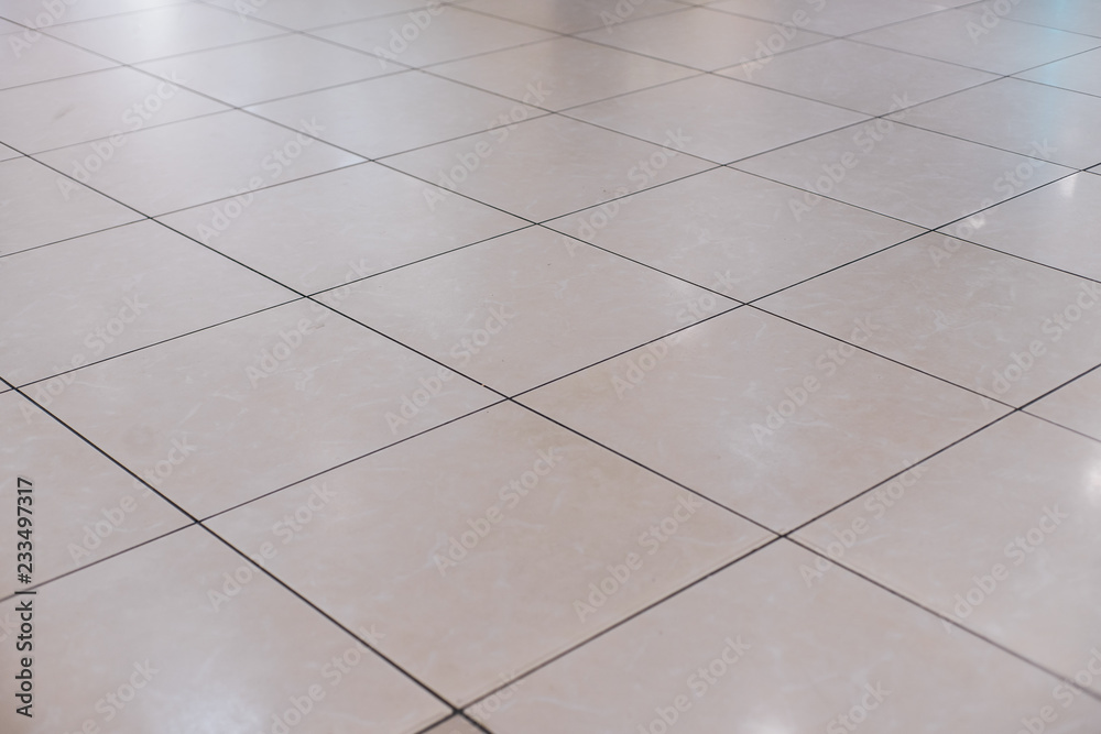 Beige tile on the floor in perspective Beige tile on the floor in perspective