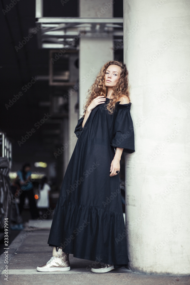 Portrait of sad girl in black dress