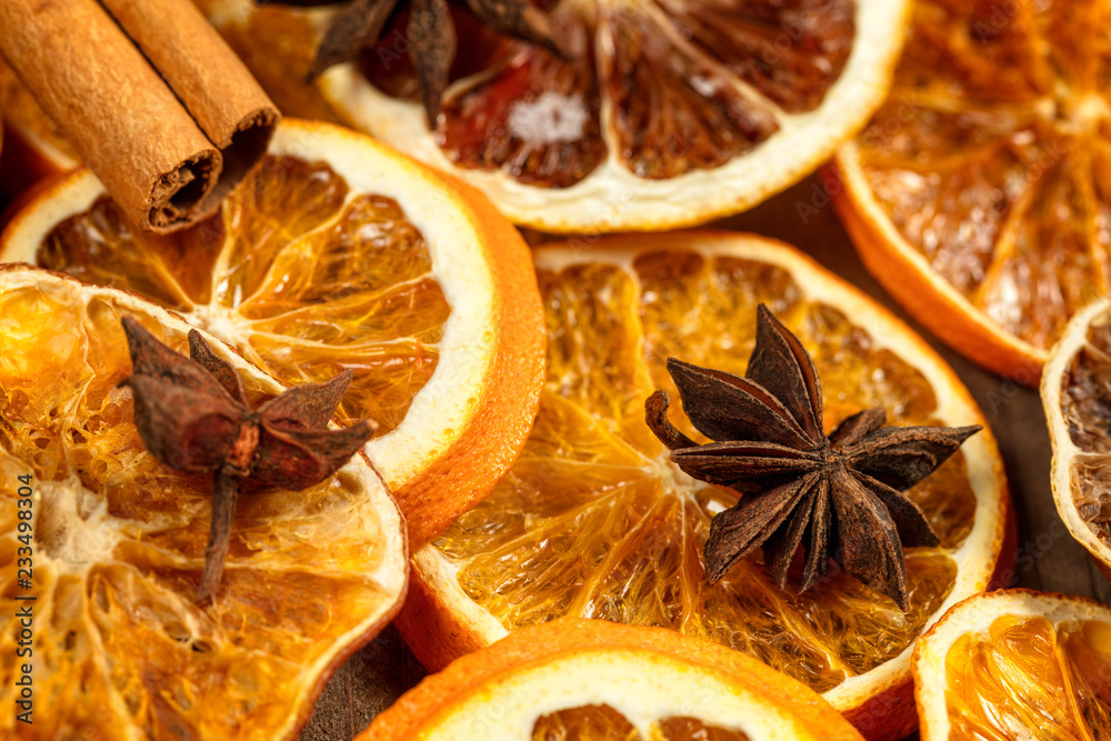 Background of dry slices of orange, cinnamon and star anise Background of dry slices of orange, cinnamon and star anise