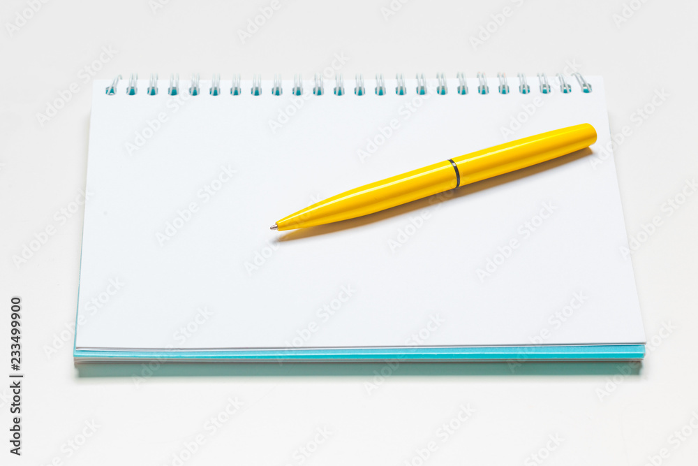 notepad notebook and ball pont pen isolated on white background notepad notebook and ball pont pen isolated on white background