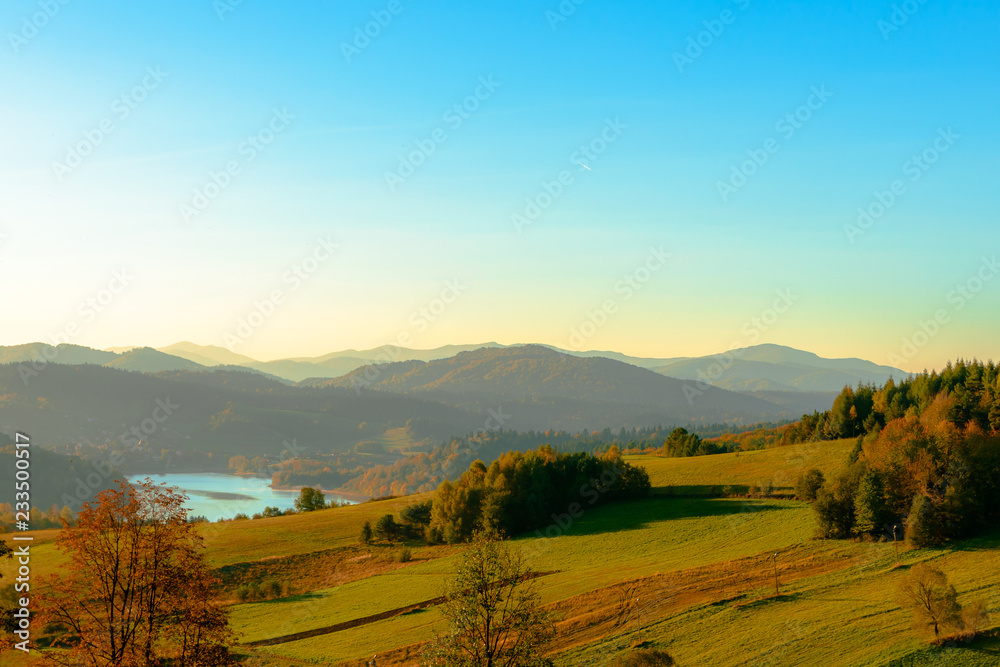 Fototapeta premium Polanczyk, Bieszczady mountains, Poland - views during sunrise on Solina Lake from hill near Polanczyk town (south-east region in Poland)