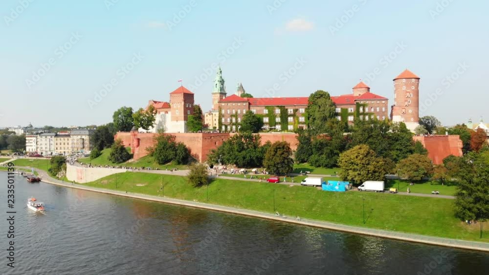 Drone rising over Vistula River, in front of Wawel Royal Castle, Krakow Poland Drone rising over Vistula River, in front of Wawel Royal Castle, Krakow Poland