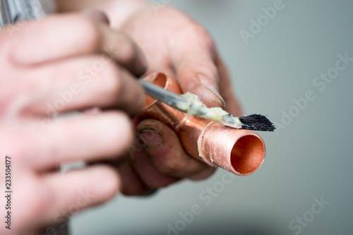 A Plumber Applies Flux