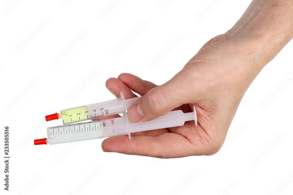 Elderly male home craftsman holds in his hand tubes with epoxy resin and hardener. Isolated Elderly male home craftsman holds in his hand tubes with epoxy resin and hardener. Isolated