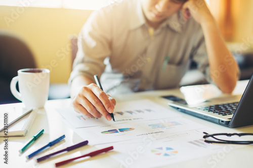 Businessman feeling sad because of suffer loss of money statement from business.Concept picture of fail, financial loss, income deficit, give up and despair.