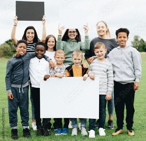 Group of diverse kids supporting a movement photo