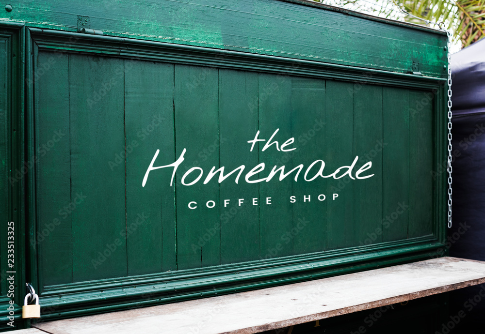 Homemade coffee shop on a green wooden wall