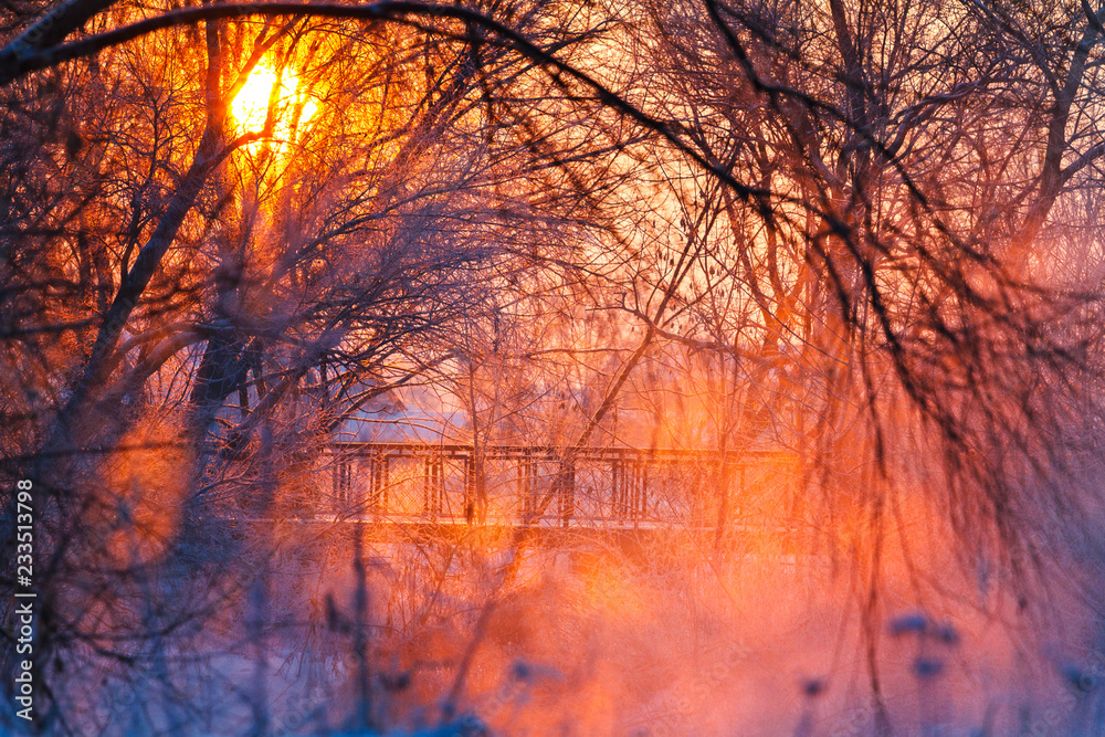 beautiful winter sunrise over a foggy river and bridge beautiful winter sunrise over a foggy river and bridge