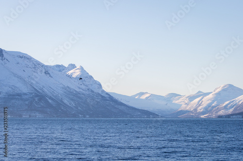 Winter landscape with mountains and sea