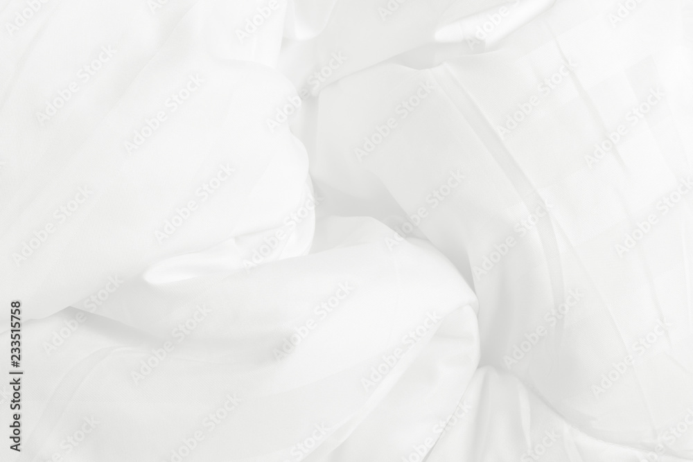 Close up top view of white bedding sheet and wrinkle messy blanket in bedroom after wake up in the morning. Close up top view of white bedding sheet and wrinkle messy blanket in bedroom after wake up in the morning.