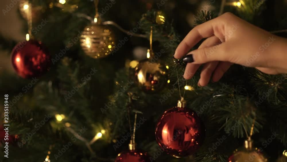 Girl decorates the Christmas tree Girl decorates the Christmas tree