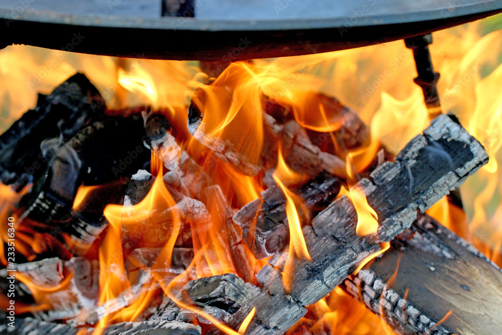 cooking on open fire, fry on a frying pan cooking on open fire, fry on a frying pan