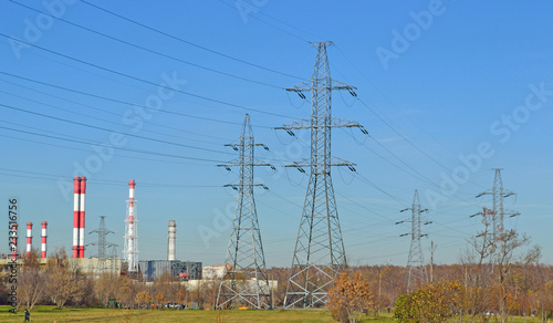 autumn industrial landscape with power lines and pipes