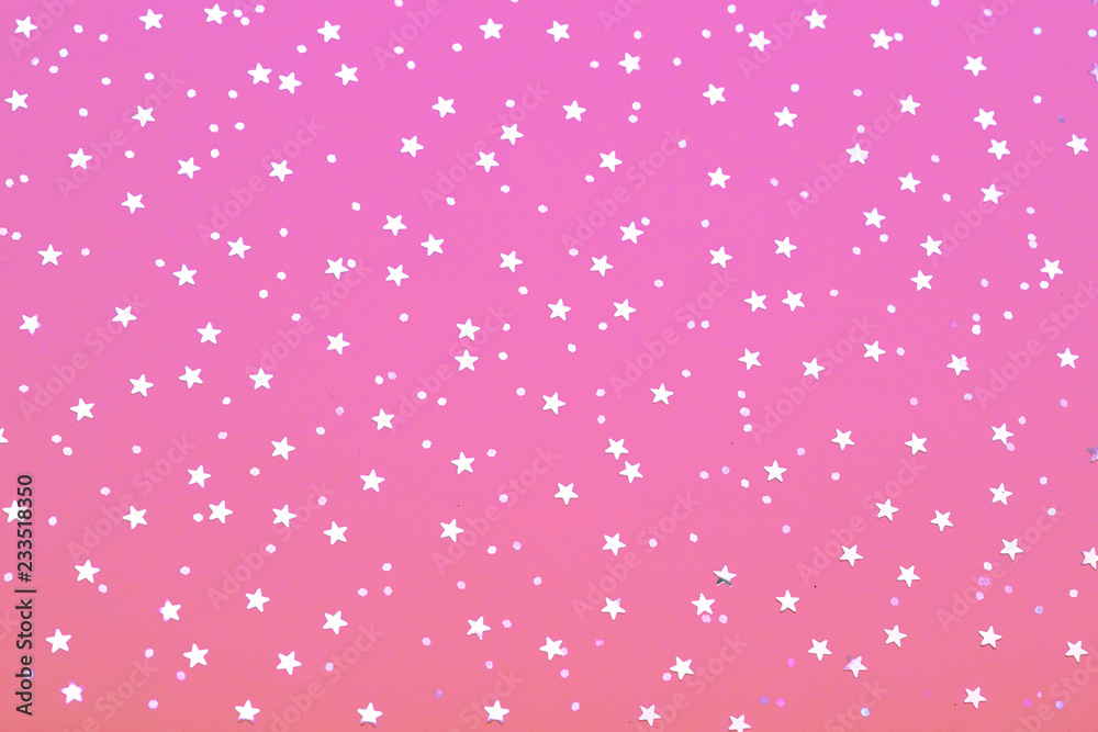 Christmas pattern made of silver stars on blue background. Winter concept. Flat lay. Christmas pattern made of silver stars on blue background. Winter concept. Flat lay.