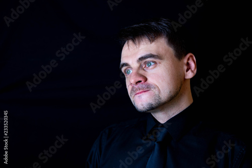 white man black background funny face