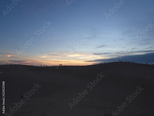 Silhouette Style Sunrise at the Big Sand Dune in Mui Ne City, Travel in Vietnam in 2012 December 7th.