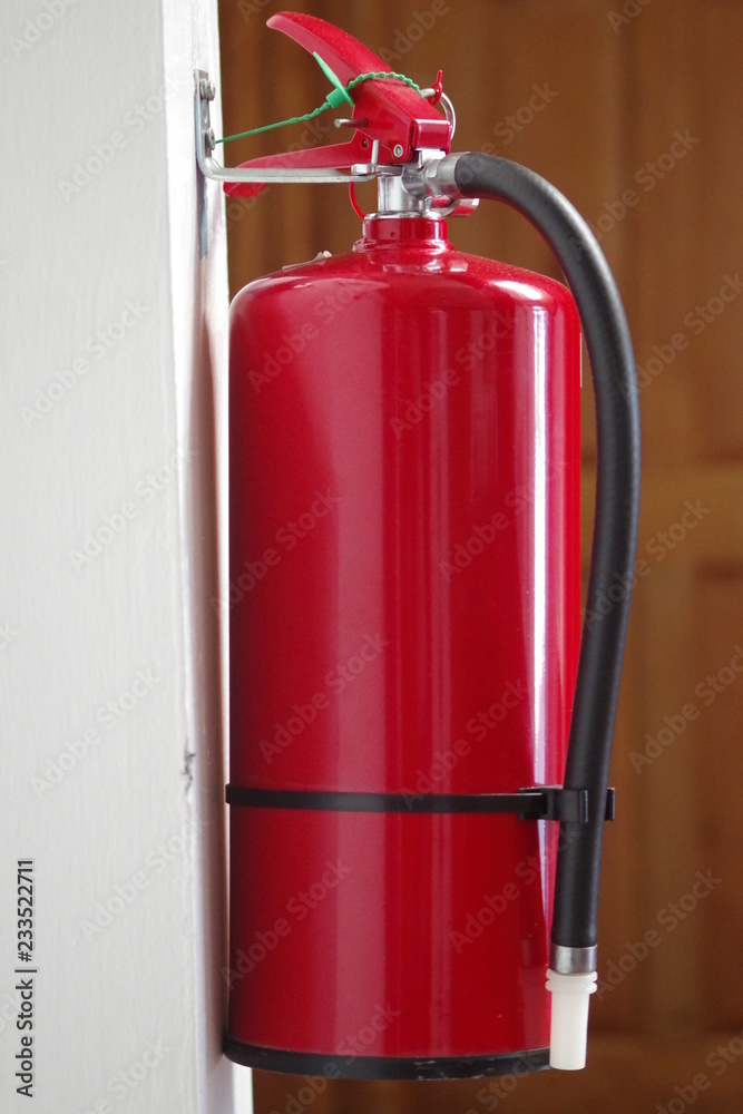 Obraz premium Close-up picture of an extinguisher ready to be used.