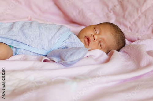 sleeping newborn baby on a blanket, copyspase