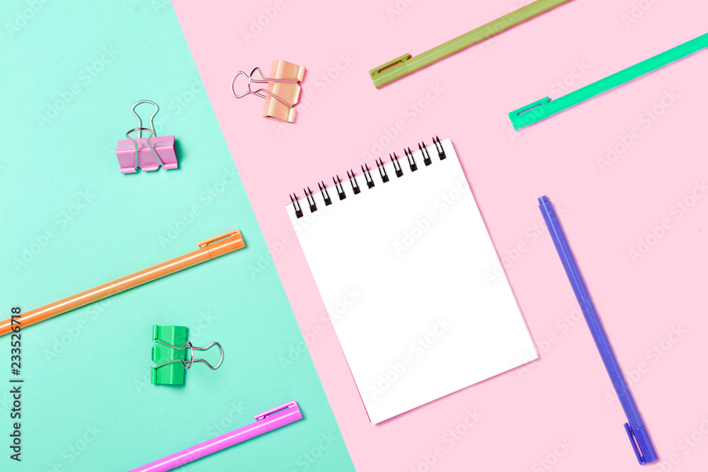 Empty Notebook or notepad on pink and blue background. Empty Notebook or notepad on pink and blue background.