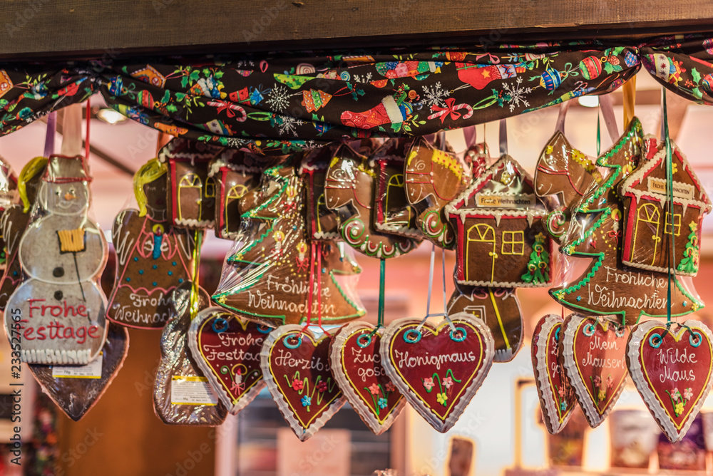 Vienna, Austria - December 24, 2017. Traditional gingerbread hearts, houses, snowman and angel at Viennese Christmas Market. Close view of Xmas fair kiosk selling sweets.