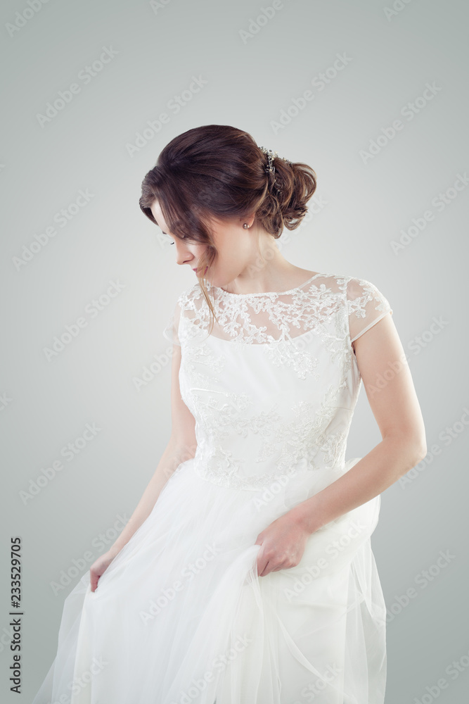 Glamorous woman with makeup and bridal hair on white background Glamorous woman with makeup and bridal hair on white background