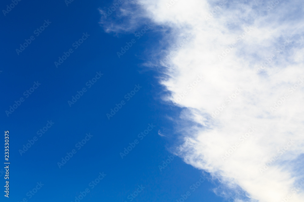 Blue sky with white cumulus clouds. Abstract natural background. Perfect summer day in the countryside. Blue sky with white cumulus clouds. Abstract natural background. Perfect summer day in the countryside.