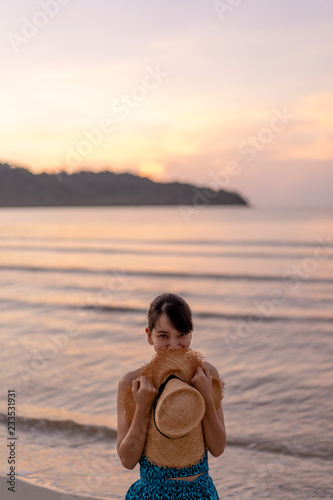 woman relaxing on the beach with sunset in koh kood island