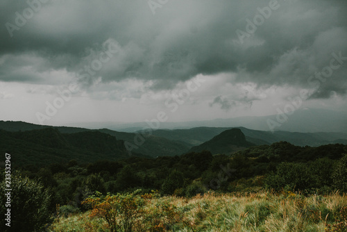 Stormy sky over the forest and hills