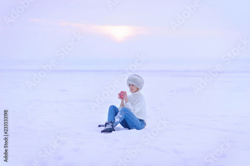 girl drinking coffee in the winter outside