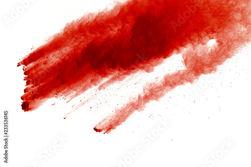 Red powder explosion on white background. Paint Holi.