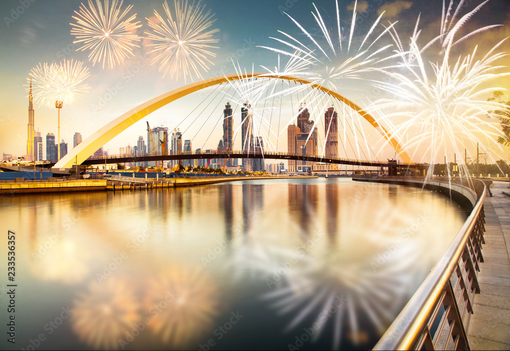 Fototapeta premium fireworks around Tolerance bridge - exotic New Year destination, Dubai, UAE