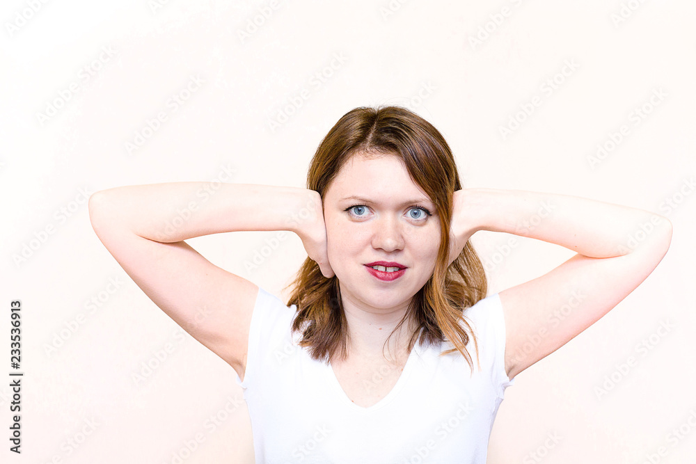 young woman closing her ears and not listening