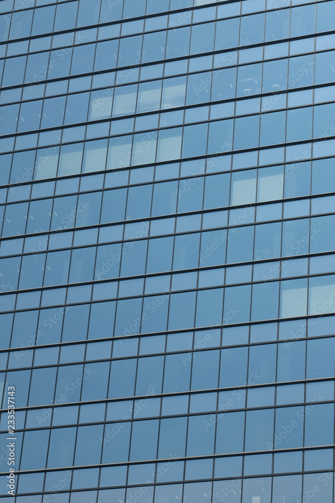 Glas facade of a business building in Ginza district, Tokyo, Japan Glas facade of a business building in Ginza district, Tokyo, Japan
