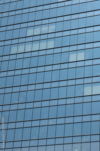 Glas facade of a business building in Ginza district, Tokyo, Japan