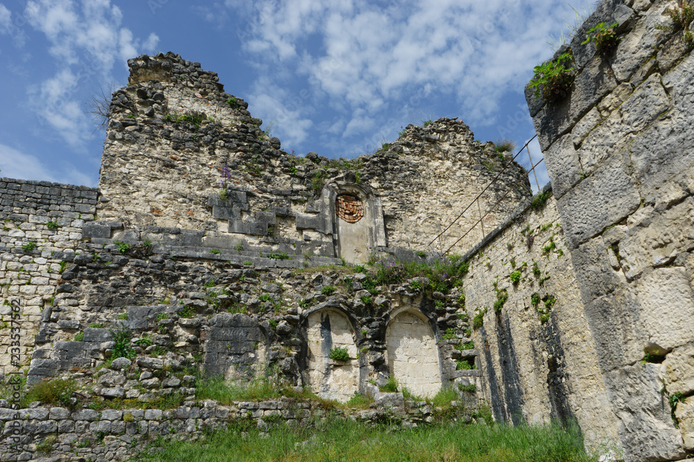ancient Anakopia fortress in ruins on the background of blue sky.