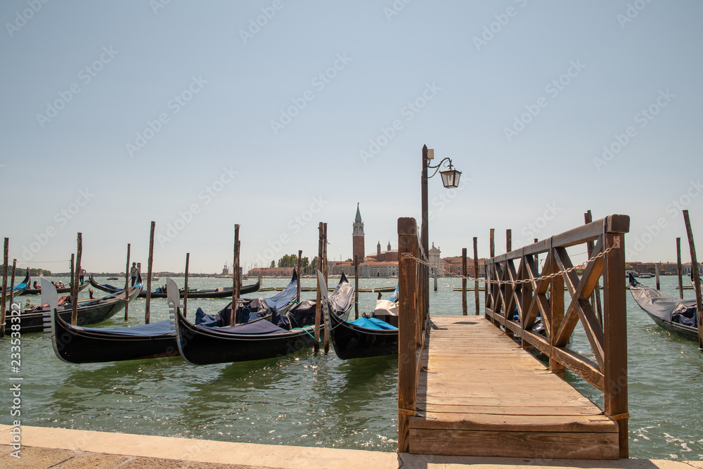 Pier with gondolas and St George Major's Island in the background, Venice, Italy