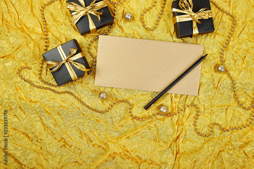 Black gift boxes with gold ribbon and blank sheet paper Black gift boxes with gold ribbon and blank sheet paper