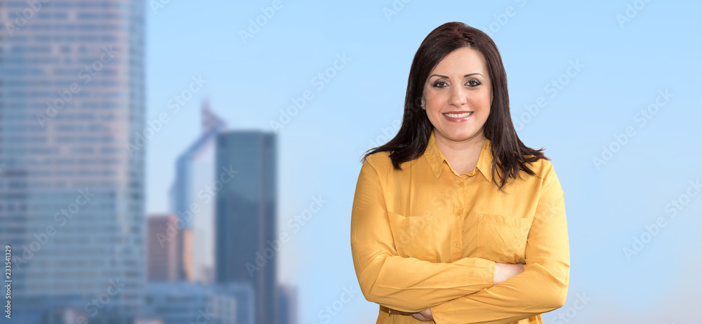 Portrait of businesswoman with arms crossed