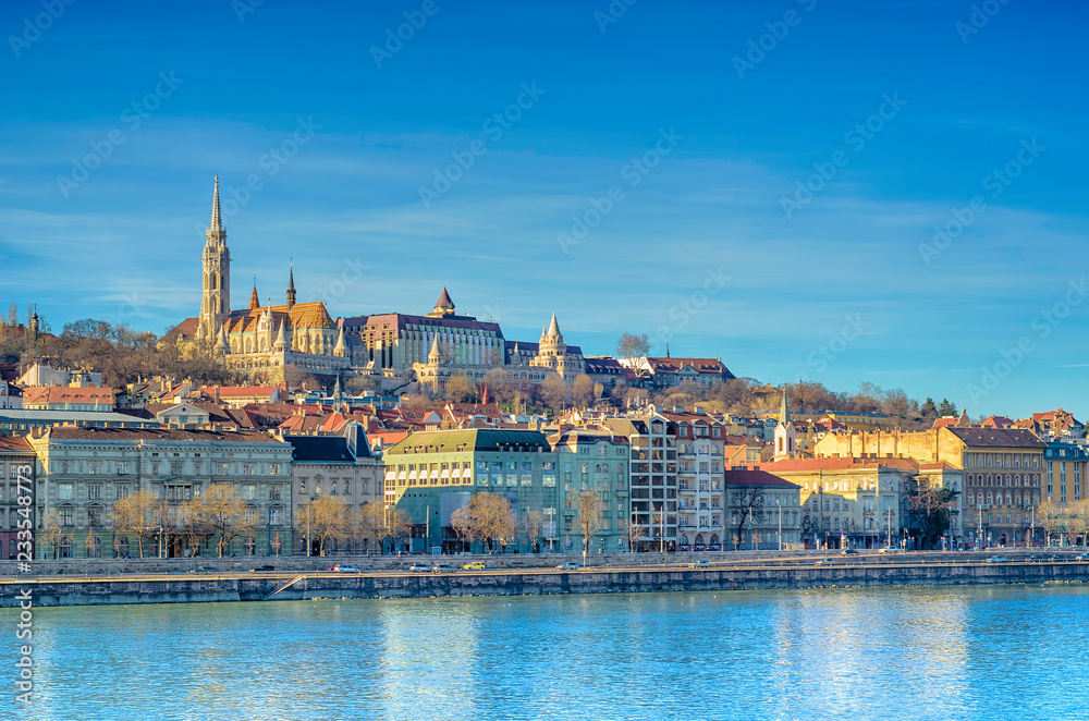 Embankment of the Danube River in Pest, Budapest, Hungary. Winter sunlight cityscape.